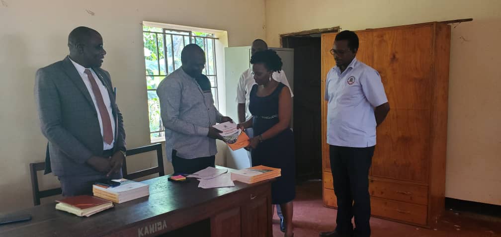 The Chief Administrative Officer - Kamuli, with pupils of Nabulezi COU Primary School after an assessment of existing structures. The assessment of the classrooms and latrines was done in Nabulezi C/U primary school, Edhirumamwino C/U primary school (both schools in Balawoli sub county). Another assessment was done in Bugulusi C/U primary school - Mbulamuti subcounty and lastly Kadaga primary school and Buwoya C/U primary school in Bugulumbya subcounty. The assessed structures will be renovated by the office of the first Deputy Prime Minister and Minister for East Africa. The Chief Administrative Officer - Kamuli, with pupils of Nabulezi COU Primary School after an assessment of existing structures